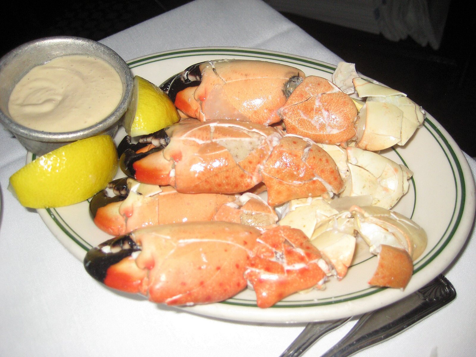 Stone crab claws served with lemon at Joe’s Stone Crab.