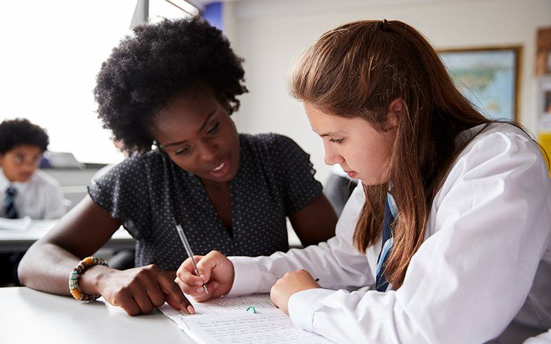 A tutor working one-on-one with a student.