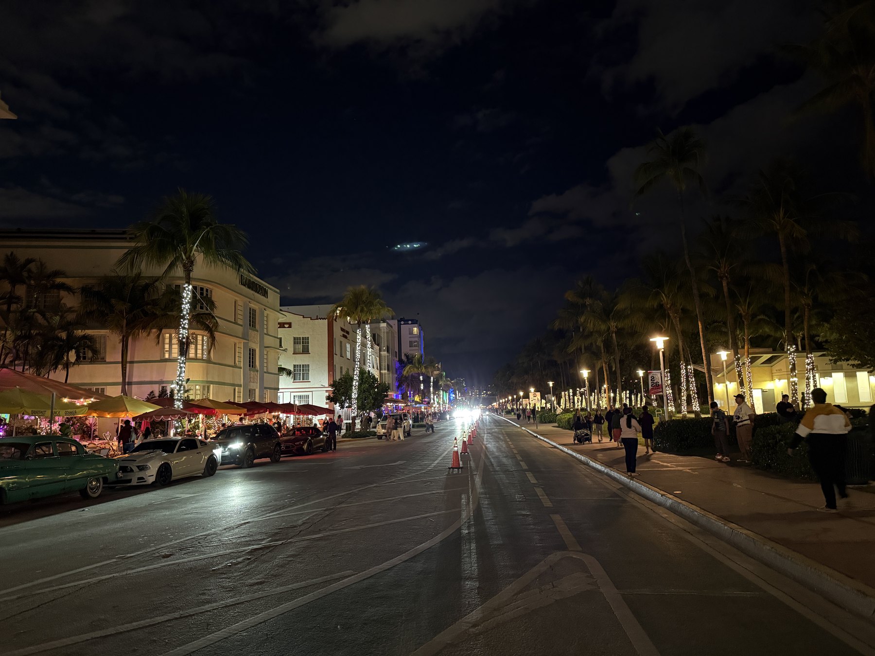 Ocean Drive in Miami Beach glowing with Art Deco neon at night.